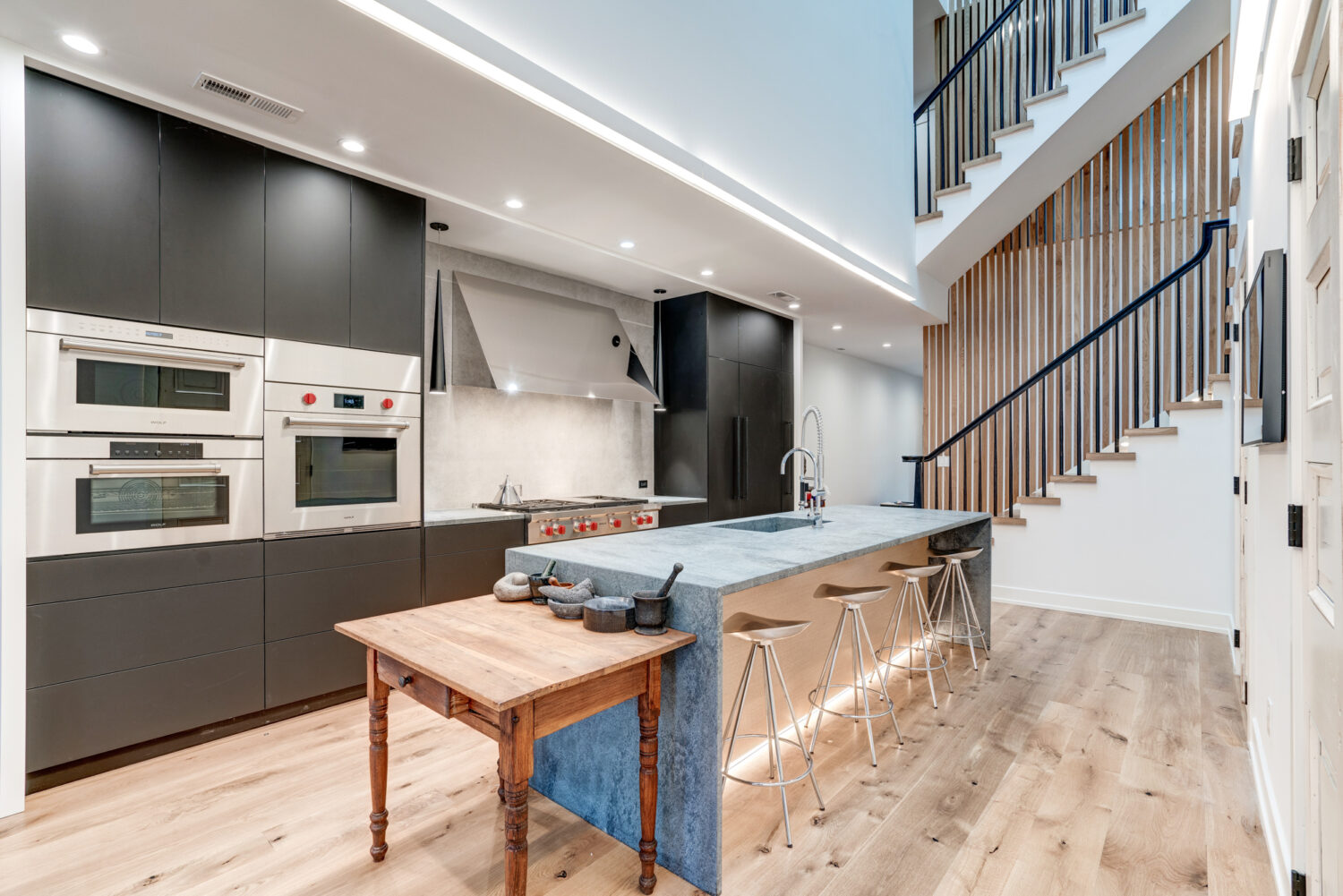 Modern kitchen design for open concept in Washington DC row home by Hammer Design Build Remodel