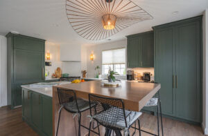 Beautiful green kitchen remodel in Bethesda, MD, featuring custom cabinetry and a modern island by Hammer Design Build Remodel